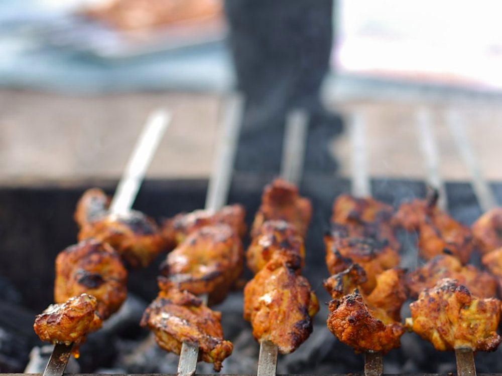Skewers over charcoal in the tandoor